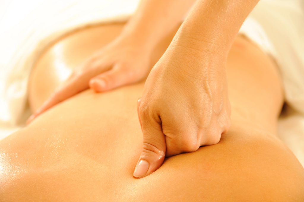 Hands Massaging a back